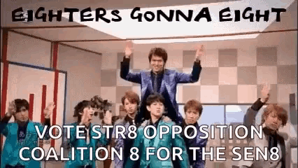 a group of young men are standing in a room with their hands in the air and a sign that says fighters gonna eight