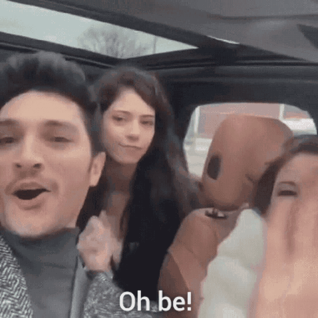 a group of people are in a car and one of them is saying oh be .