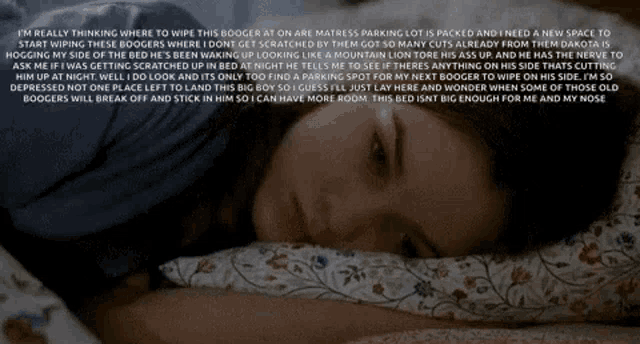a woman laying on a bed with a text behind her that says i 'm really thinking