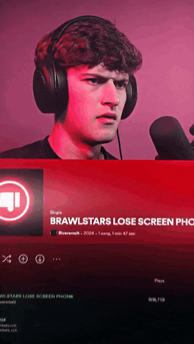 a man wearing headphones stands in front of a microphone with a red background that says brawlstars lose screen phones