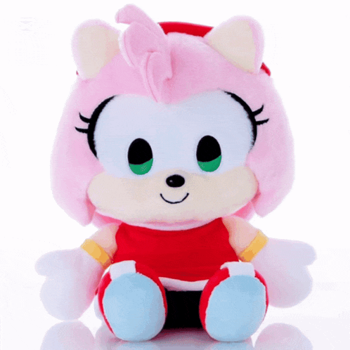 a stuffed amy rose from sonic the hedgehog is sitting on a white surface