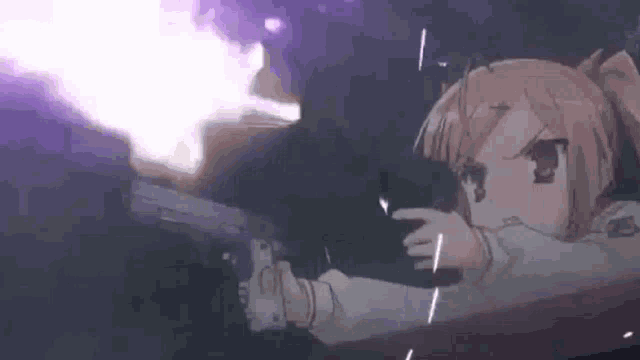 a girl is holding a gun in her hand and pointing at it .