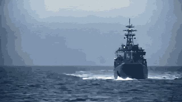a large ship is floating on top of a body of water in the ocean