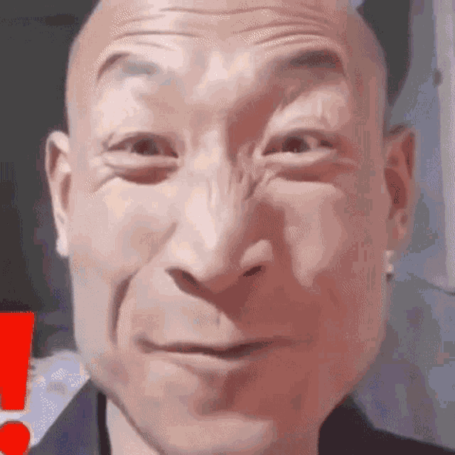 a close up of a man 's face with a big nose .