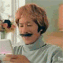 a man with a fake mustache is wearing a wig and a turtleneck sweater .