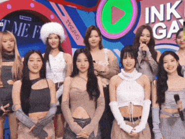 a group of women are posing for a picture in front of a sign that says ink ga