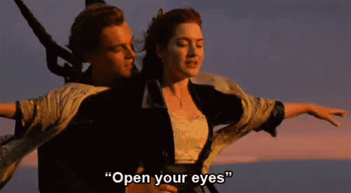a man and a woman are on a boat and the woman is saying " open your eyes "