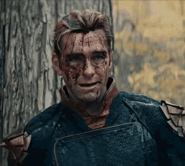 a man with blood coming out of his face is standing next to a tree