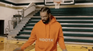 a man wearing an orange hoodie that says nocta