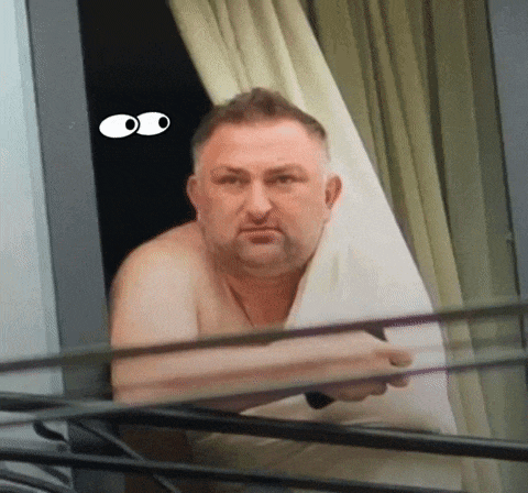 a man without a shirt is looking out a window with cartoon eyes on his face
