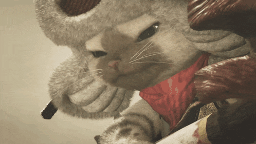 a cat with a red scarf around its neck is holding a knife