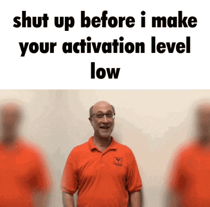 a man in an orange shirt says " shut up before i make your activation level low " in front of two other men