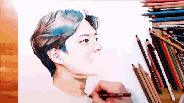 a drawing of a man with blue hair is surrounded by colored pencils including one that says marte