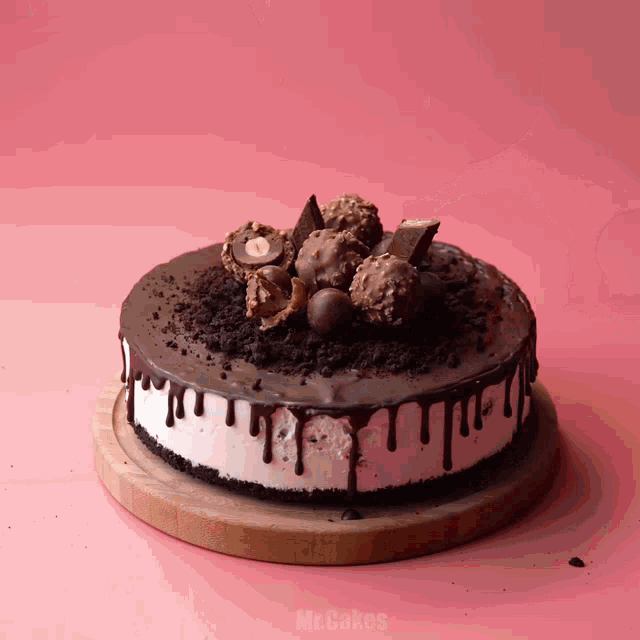 a cake on a wooden cutting board that says mr.cakes on it