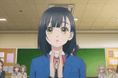 a girl in a blue jacket stands in front of a group of girls