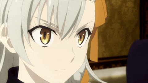 a close up of a girl 's face with yellow eyes