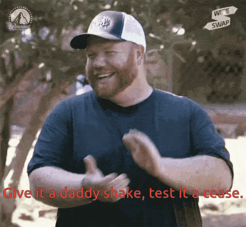 a man with a beard wearing a hat says give it a daddy shake and test it a cease