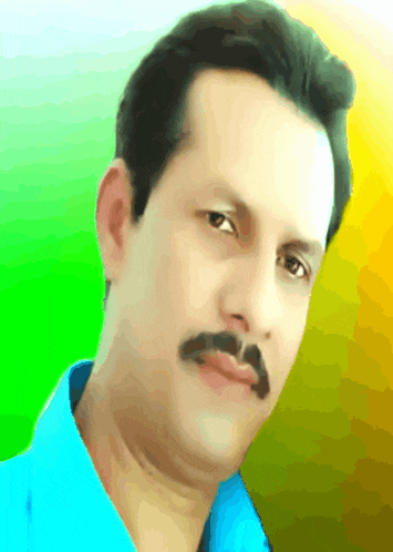 a man with a mustache is wearing a blue shirt and looking at the camera