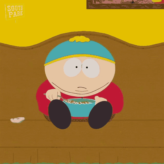 a south park character is sitting on a bench eating cereal