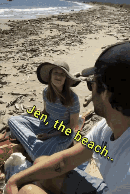 a woman in a hat sits next to a man on a beach with the words jen the beach below her