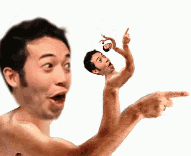 a man without a shirt is pointing to another man 's head