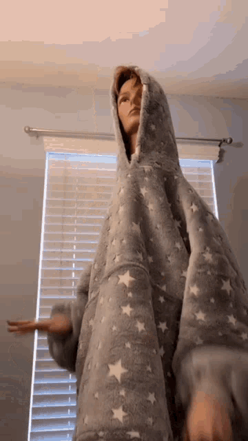 a mannequin is wearing a blanket with stars on it