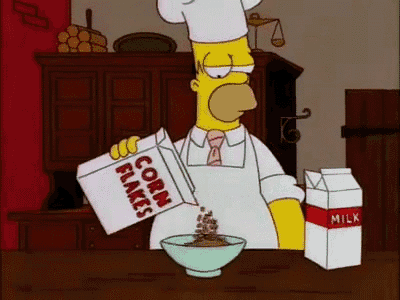 homer simpson is pouring a box of corn flakes into a bowl of cereal .