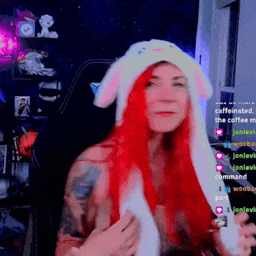 a woman with red hair is wearing a white bunny hat with ears