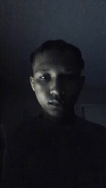 a blurry picture of a person 's face with a grid pattern .