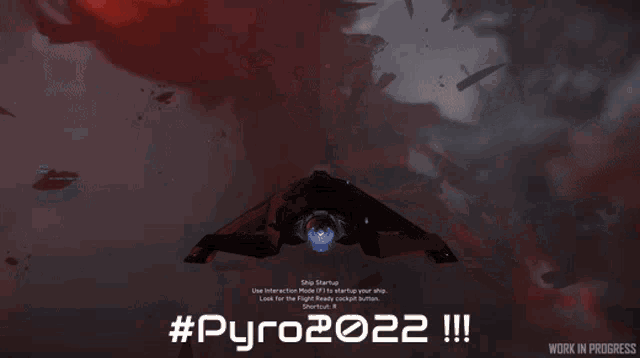 a screen shows a space ship and the words #pyro2022