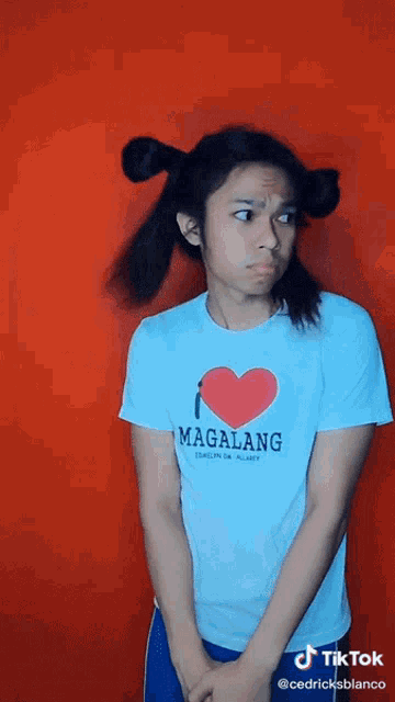 a girl wearing a white t-shirt that says " i love magalang "