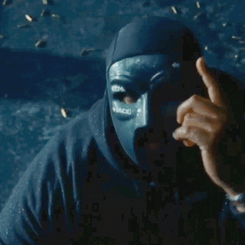 a man wearing a mask with the word paco on it