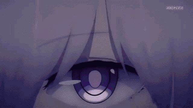 a close up of a person 's eye with a purple iris and a purple pupil .