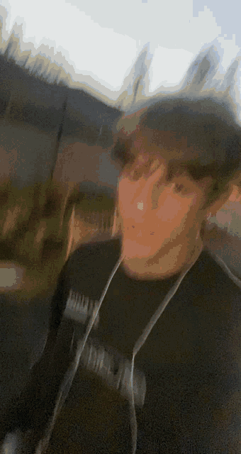 a blurry picture of a man wearing a black shirt that says human