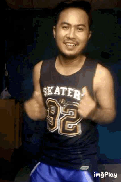 a man wearing a skater shirt is dancing