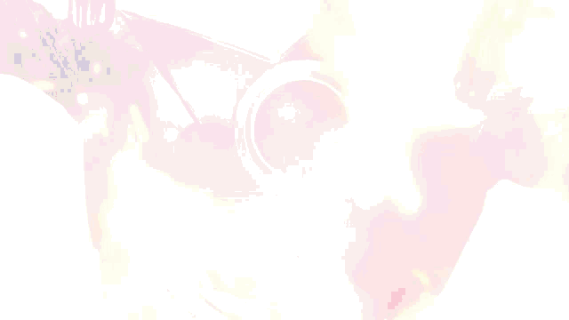 a close up of a person 's face with a red circle in the middle