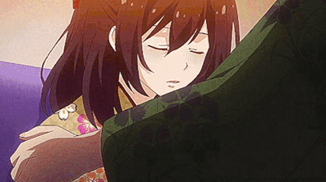 a girl is sleeping on a man 's lap