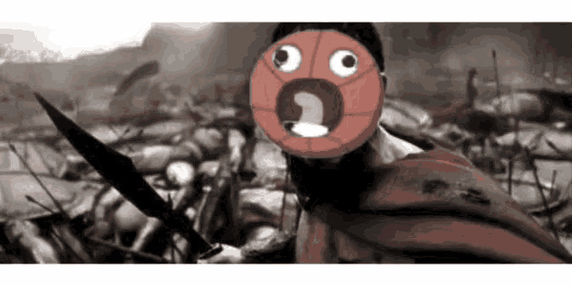 a man in a red cape with a basketball face on his face