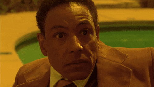 a man is laying in a swimming pool with a yellow background