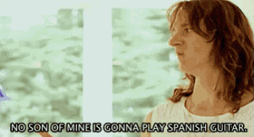 a woman says that no son of mine is going to play spanish guitar