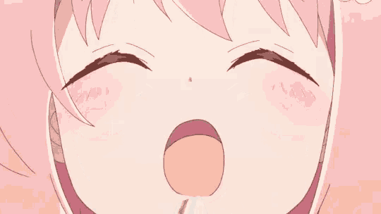 a close up of a girl 's face with blue eyes and pink hair
