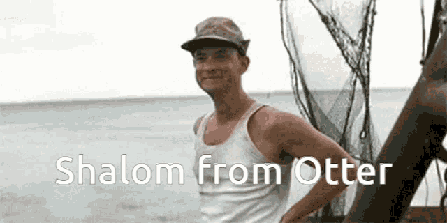 a man in a hat is standing in front of the ocean with the words shalom from otter written on the bottom