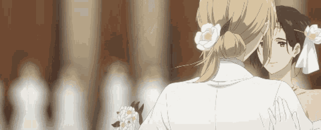 a woman with a flower in her hair is holding another woman