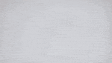 a close up of a blue and purple toy with a white background .