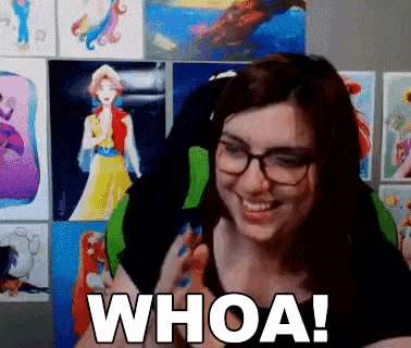 a woman wearing glasses says whoa in front of a wall of pictures