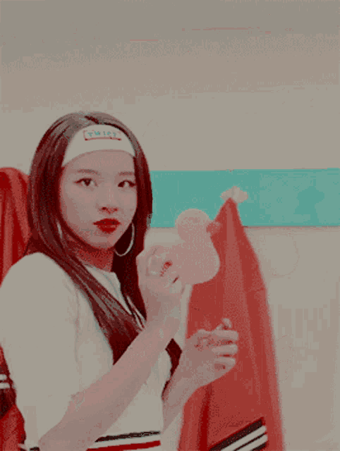 a girl with a headband that says twice on it