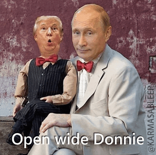 a man in a suit is sitting next to a puppet with the caption " open wide donnie "