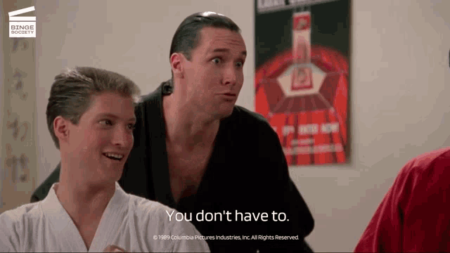 a man says you don t have to in front of a poster