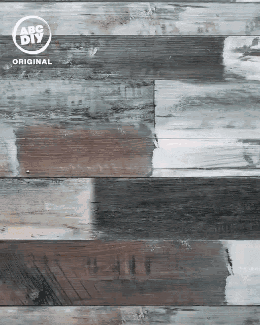 a wooden surface with a abc diy original logo on it