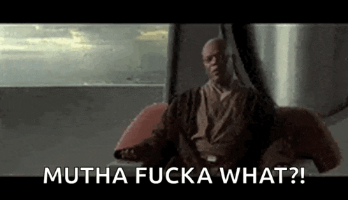 a man is sitting in front of a window with the words `` mutha fucka what ? ''
